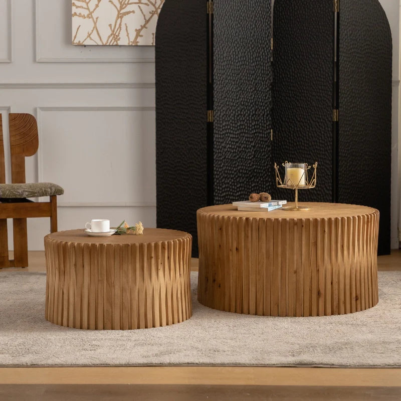 a wooden round coffee table in a modern living area