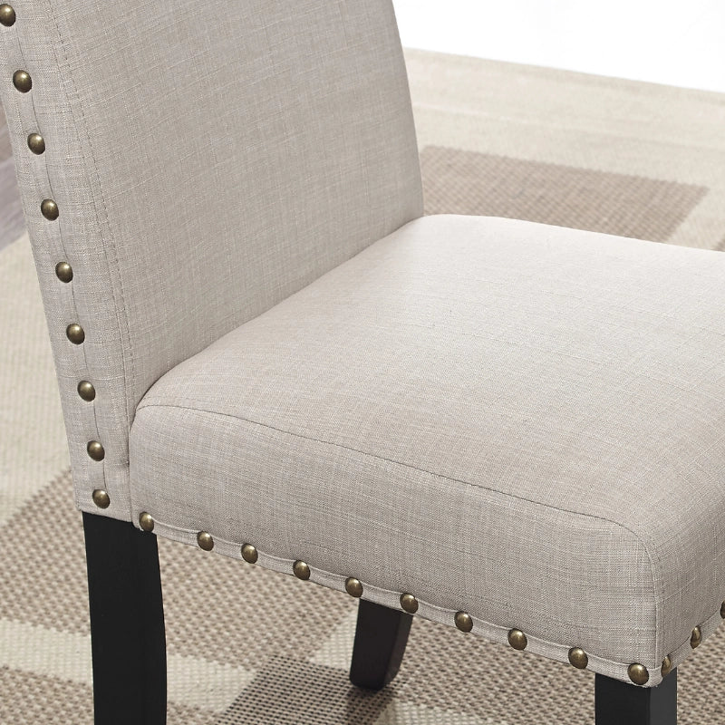 Nailhead Design of the Tan Upholstered Wood Dining Chair