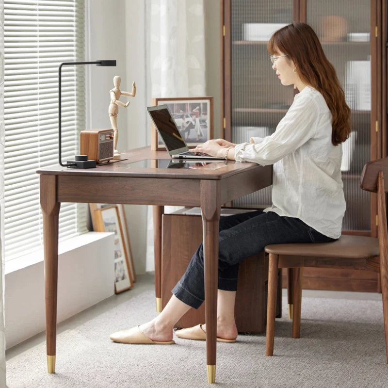 a wood desk with drawers and a tempered glass top and a led strip