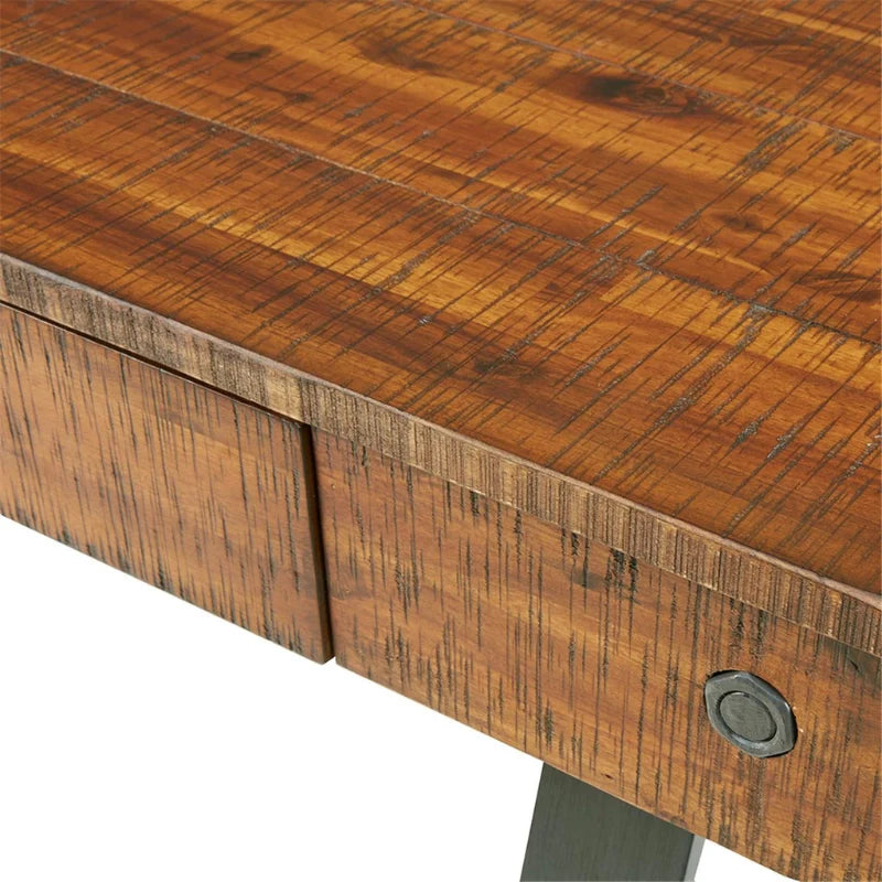 Sectional image of wood desk with drawer showing its amber wood finish