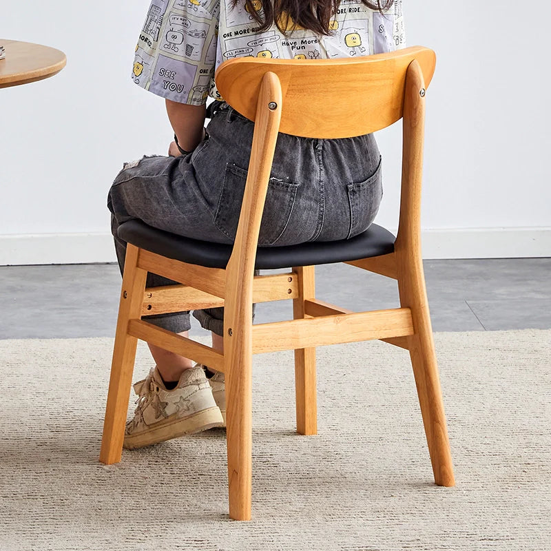 Wood dining chair showcasing its comfortable seatin from a back view