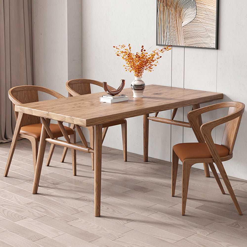 Wooden Dining Table with Three Dining Chairs and minimal décor in an elegant and spacious dining space