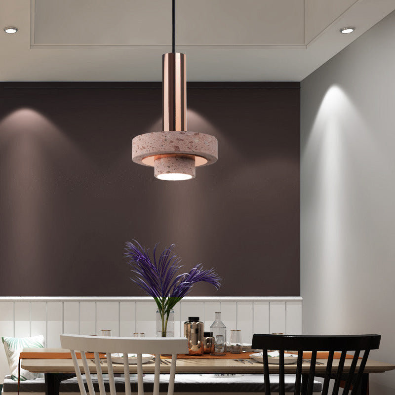 Kitchen pendant light turned on over a modern dining area