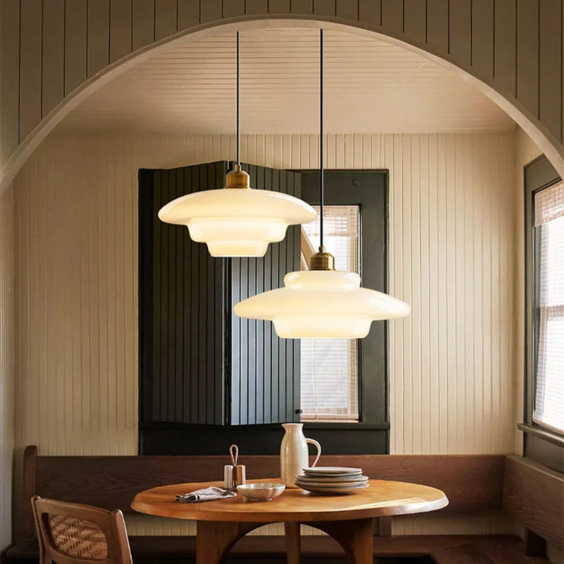 modern kitchen pendant lights suspended above a table