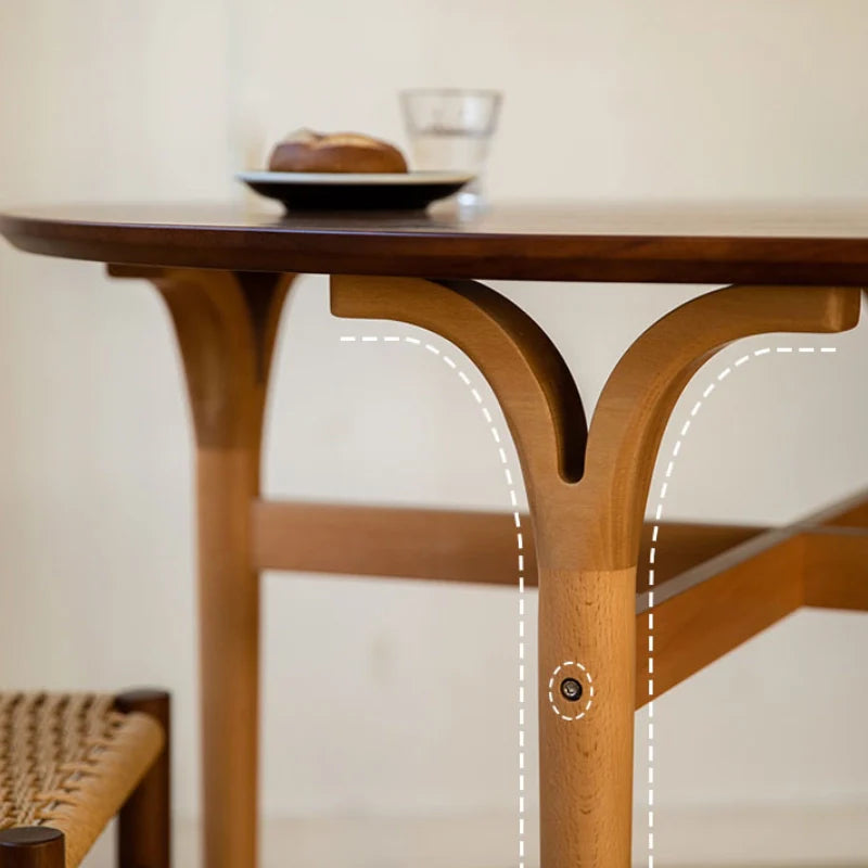 a solid wood dining room table with intricate wood carvings