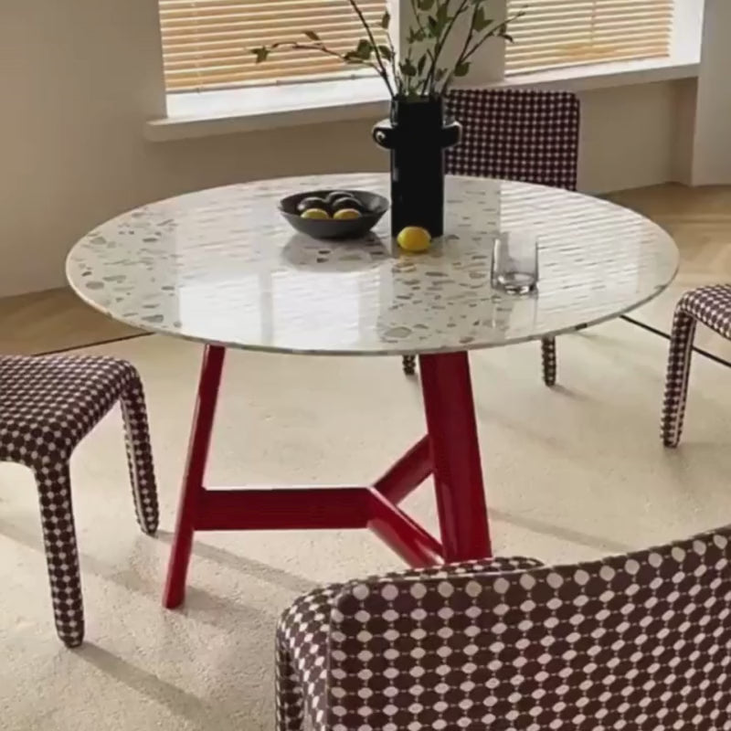 a wood dining table set in a modern living area, and paired with matching dining chairs