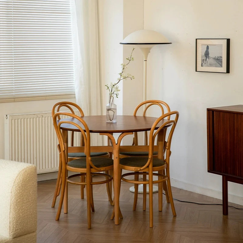 a wood dining table with 4 dining chairs