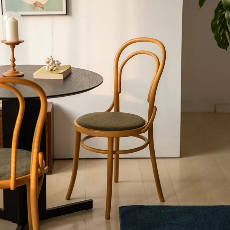 thonet chairs paired with a wood dining table