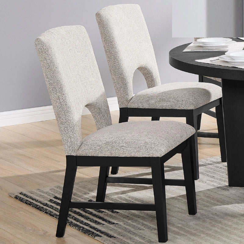 Two upholstered dining chairs of round wood dining table set