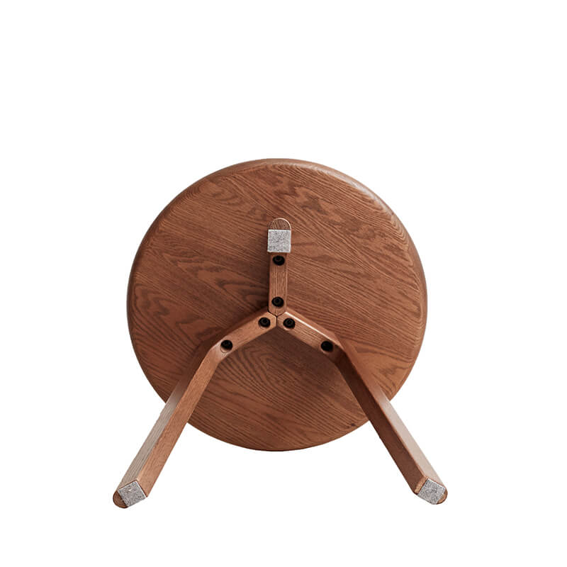 a round wooden end table showcasing its underneath details