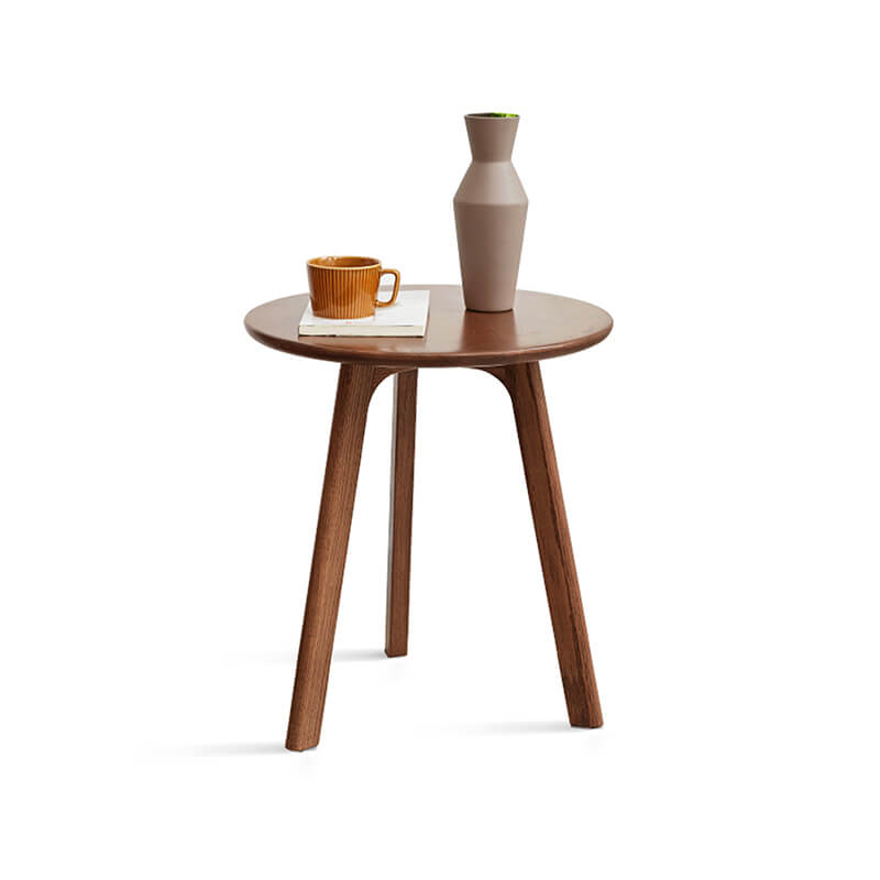 a round wood end table in a white background