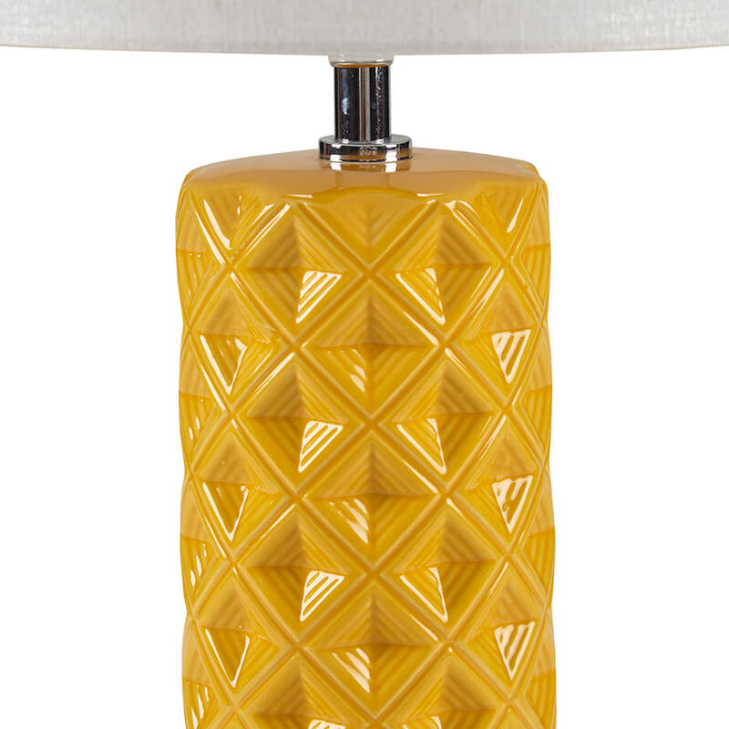 the patterned cylinder base of a ceramic table lamp