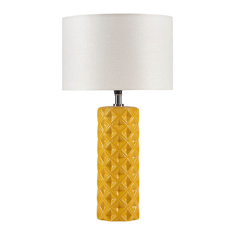 a large ceramic table lamp in a white background