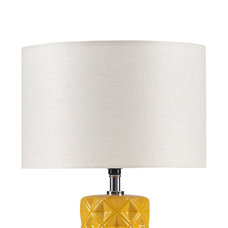 the white fabric shade of a table lamp ceramic 