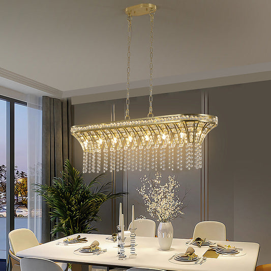 Island chandelier illuminating a modern dining space 