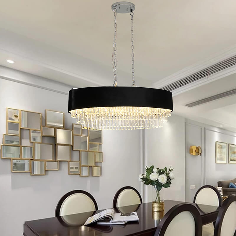 Linear dining chandelier hanging above a modern dining set