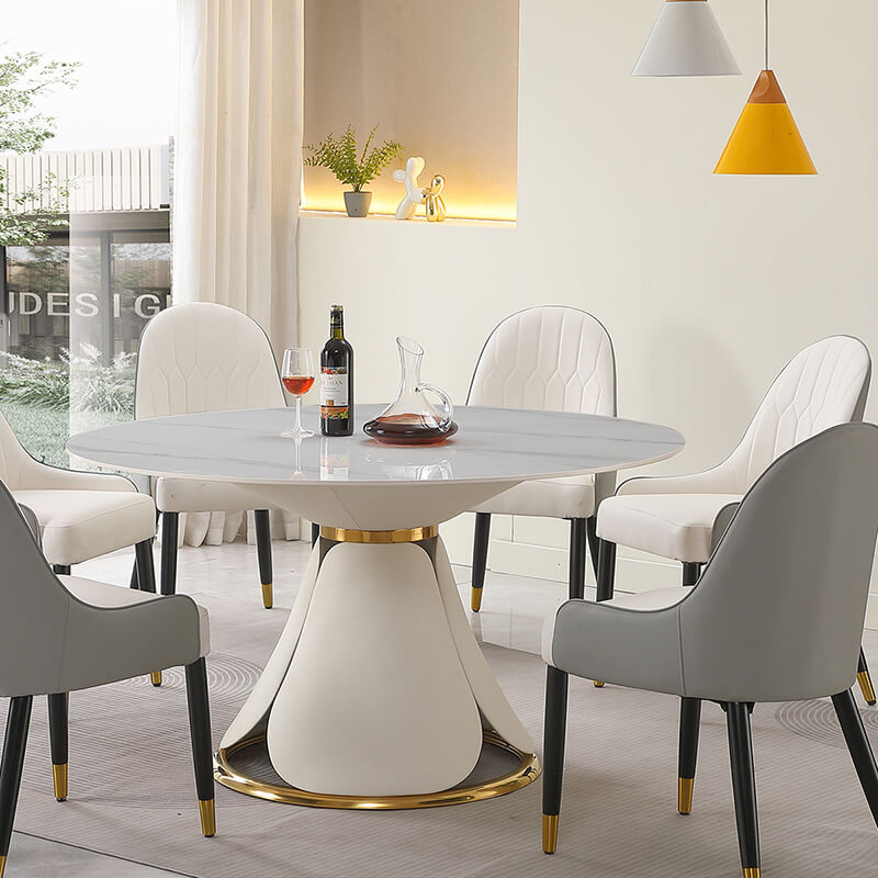 round table with 6chairs arranged with wine on the table and jug and a glass of wine 