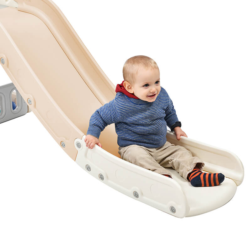 A baby sliding through the  slidder