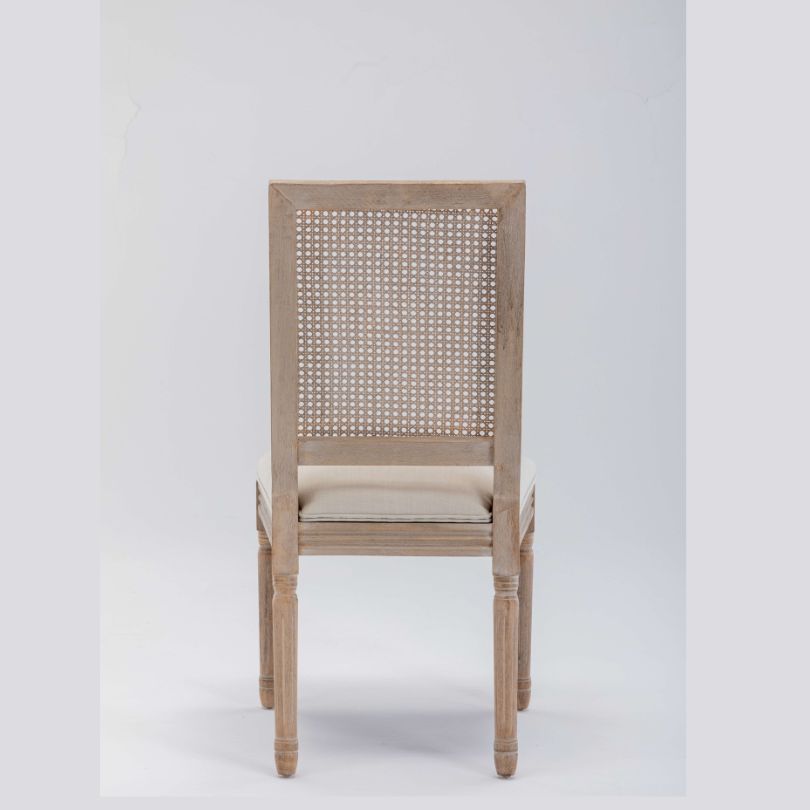 A back-view showing the Rattan back rest of the dining chair