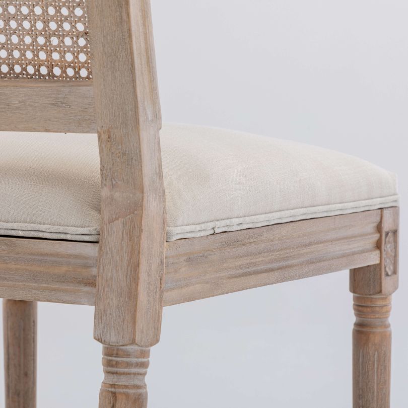 A zoom image of the solid birch wood and smooth finishing of the beige dining chair